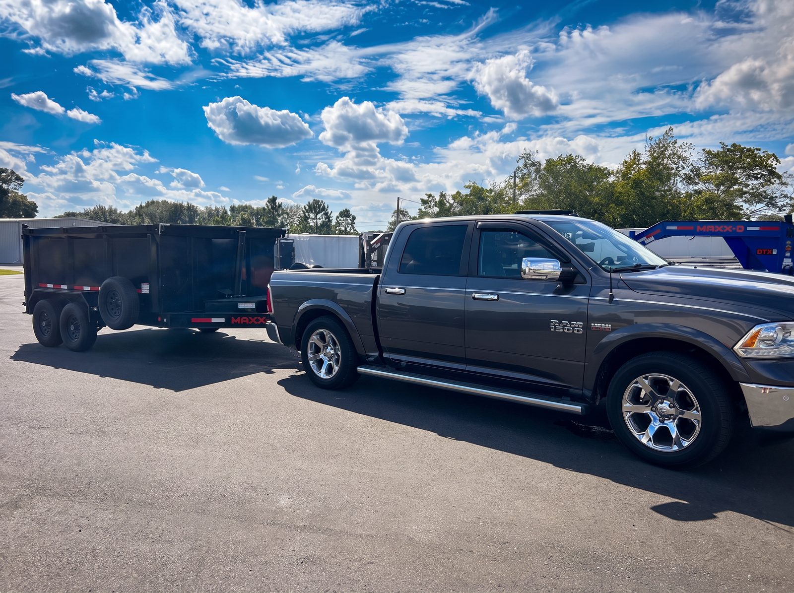 Junk Star Hauling truck and dump trailer ready for a junk removal job in Ocala, FL